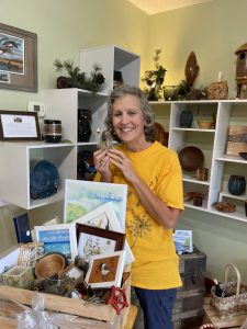 Nancy Smith winner of a basket full of artwork made by Long Lake Artisans Gallery artists.